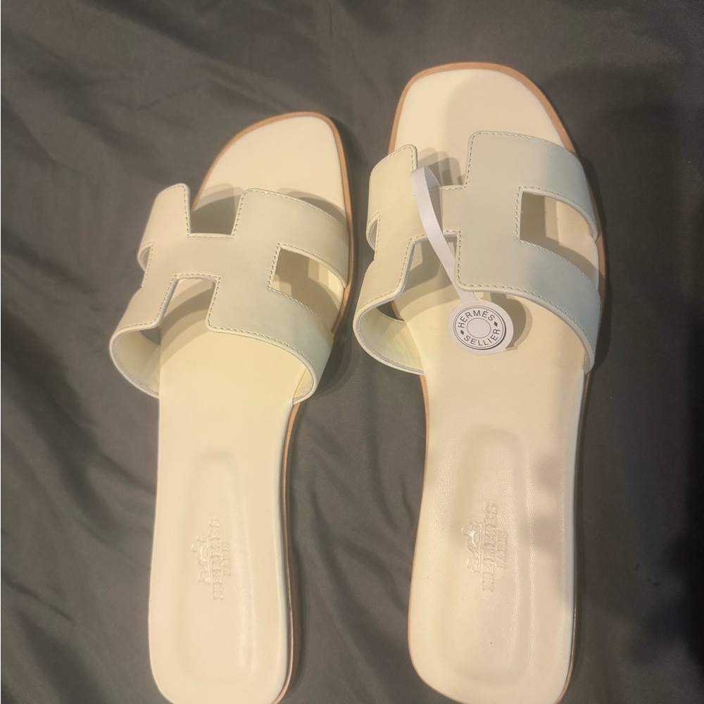 Hermes Oran sandals cream.